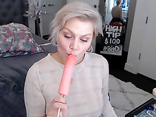 Gorgeous Babe Reveals Her Hooters And Suck A Popsicle