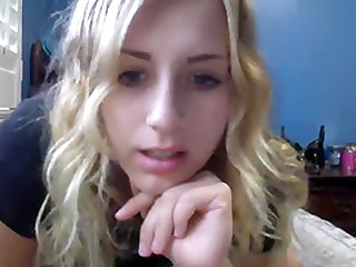 Blonde teen with amazing blue eyes and big tits has some fun online.